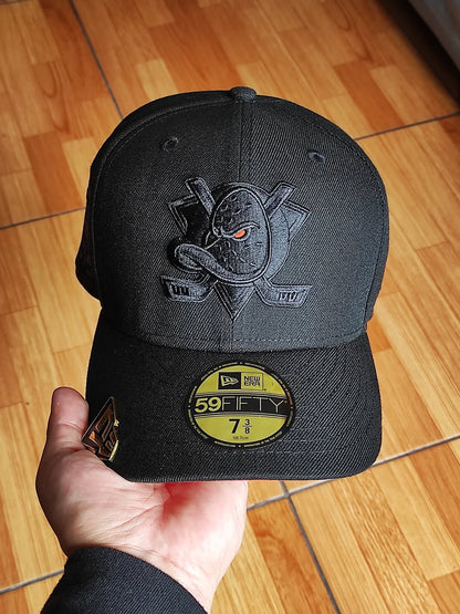 New Era Anaheim Ducks 30th Anniversary Blackout Orange Laser Prime Edition 59Fifty Fitted Hat